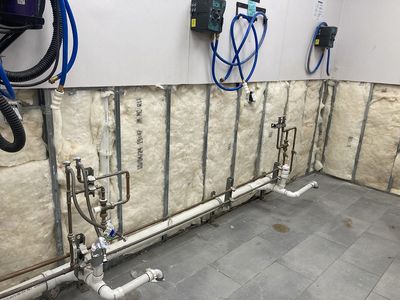 Freshly installed wall insulation in commercial building