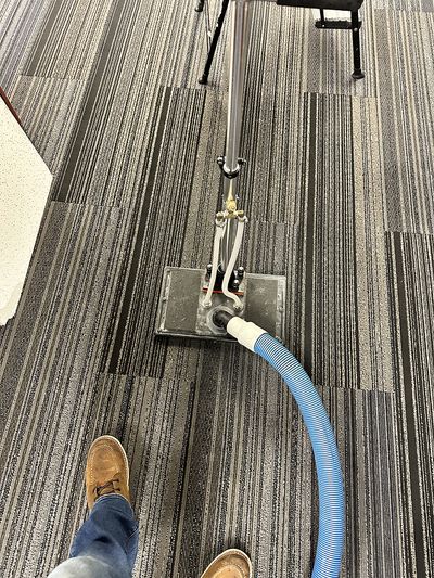 New carpet installed and being cleaned in commercial building