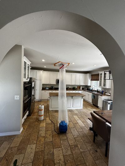 Negative air pressure system set up in kitchen ceiling to prevent mold from spreading