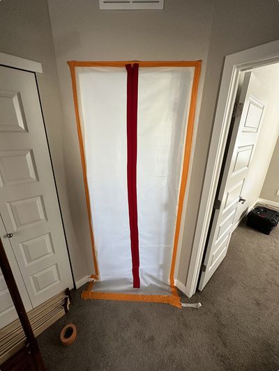 Zipper wall installed over door to mitigate mold contamination re-order